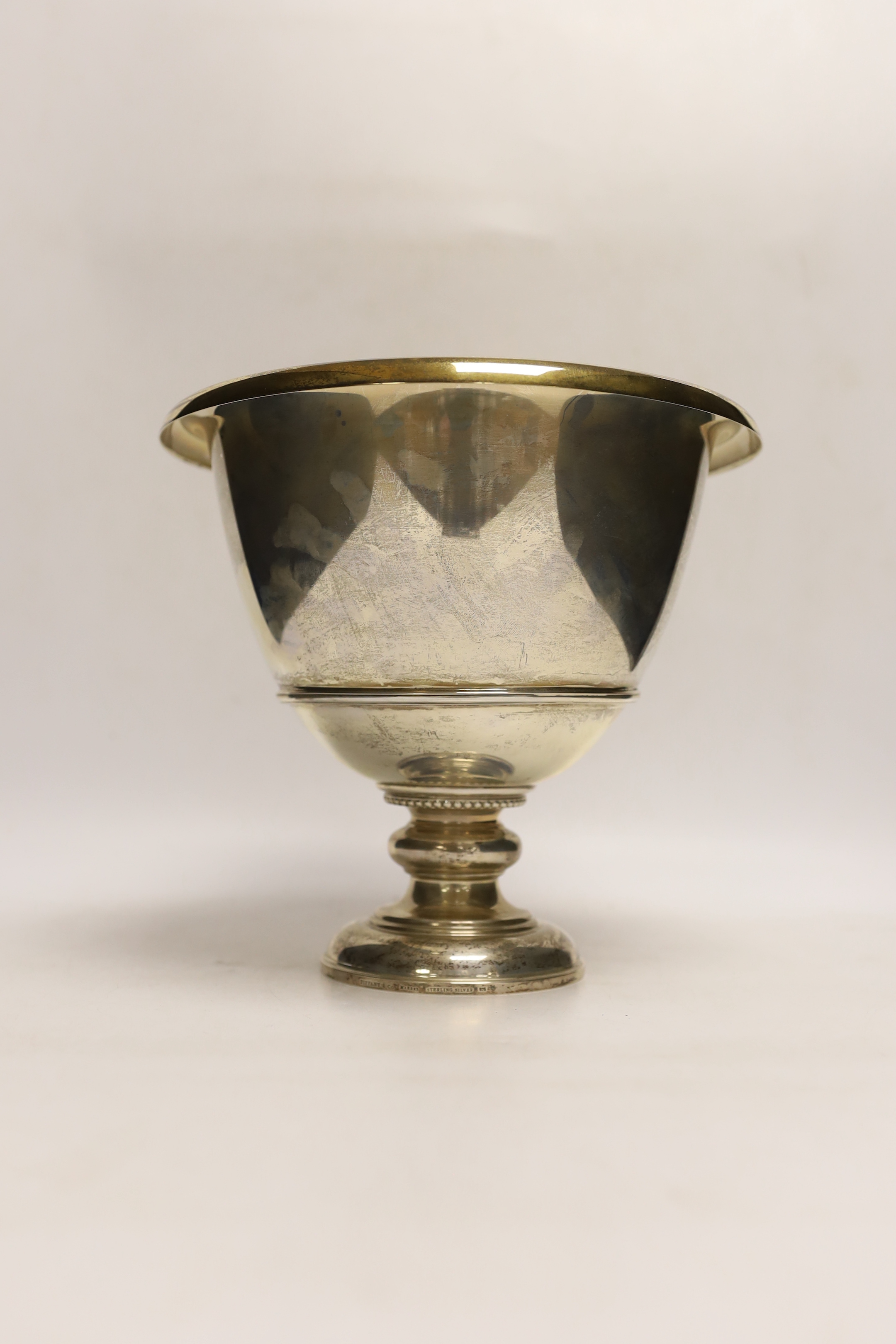 A Tiffany & Co sterling presentation pedestal trophy cup, with engraved inscription, 'The Sta. Elena Cup' and gilded interior, height 21.5cm, 39.1oz.